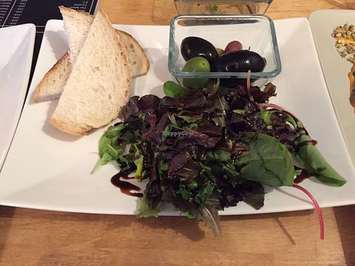 Green salad, olives and sourdough (vegan) at Vas Manci in Budapest