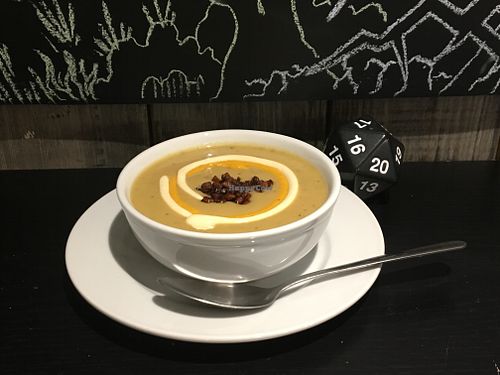 Vegan Loaded Baked Potato soup with vegan creme fraiche, cheese sauce and tempeh bacon bits at Table Top Cafe in Edmonton