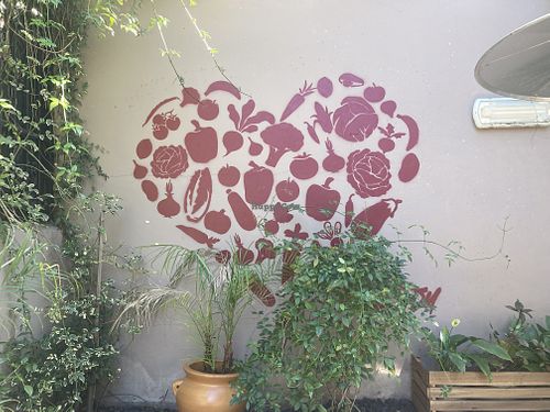 Wall painting reminded me of older vegan cookbooks and Benjamin Zephaniah  at Nic's on Beverly in Los Angeles