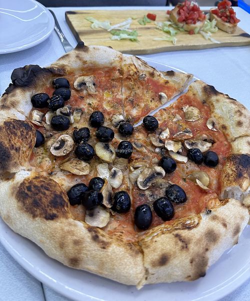 Margarita pizza with no cheese, and with mushrooms and 1/2 olives  at Pizzeria Alle Scalette in Siena