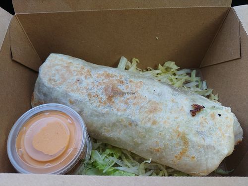 $13.00 Chorizo Burrito 🌯 with Verde sauce: Amazing, my partner's favorite burrito ever and he's tried almost every burrito available. I found the spice kept building and became  at Modern Times Beer in Santa Barbara