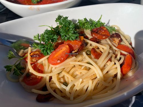 Spaghetti Puttanesca comes in olive oil, capers, roasted tomato, olives. It was delicious. at Loveria Caffè in Colleyville