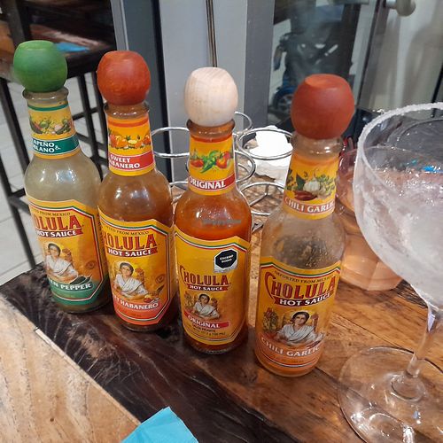 Plenty of vegan hot sauces :-) at Tipico Latino in Noumea