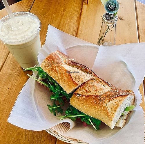 Benefit Baguette made with arugula, roasted peppers, and olive tapenade. And then I added pickled onion and pickled carrot for extra toppings. Smoothie is the Nutty Monkey.  at Benefit Juice Bar & Cafe in Providence