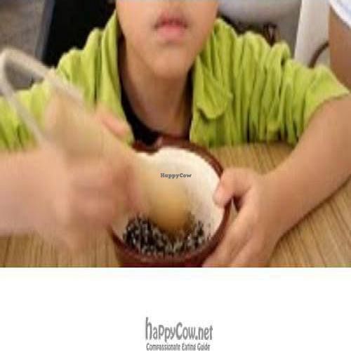 Kid enjoy the blessing of the sesame (Bloss) at Naive in East Singapore