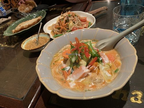 Delicious vegan red curry & roti with peanut paste. Papaya salad is not vegan (contains fish sauce)   at @Thai in Queenstown