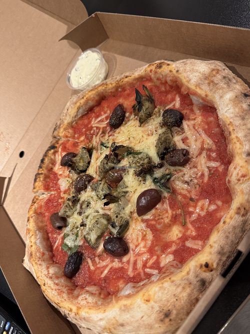 Marinara with artichokes, Kalamata olives, & vegan cheese. Garlic dip  at Franco Manca in Birmingham