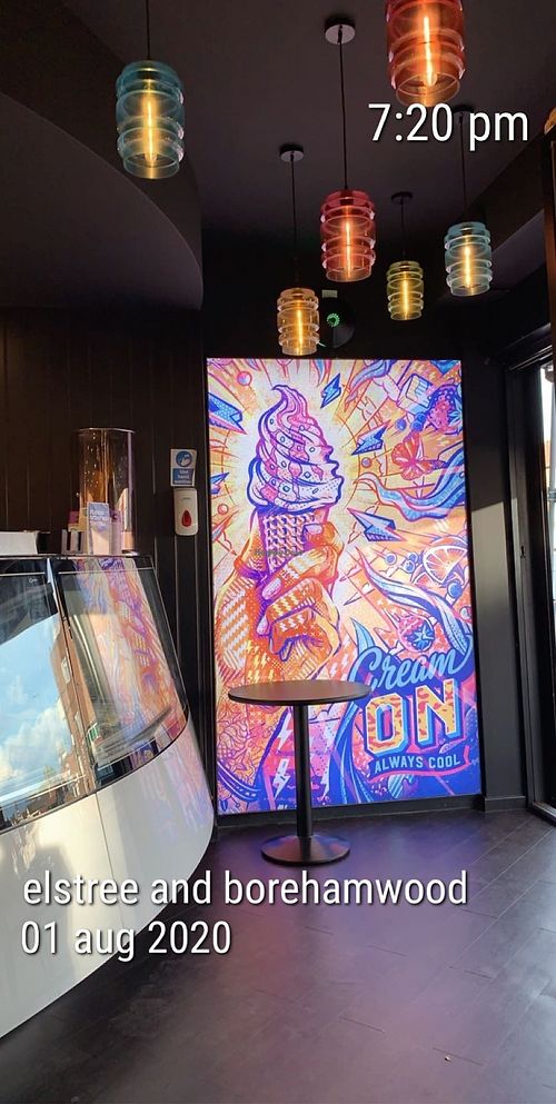 interior signage at Creams Cafe in Borehamwood