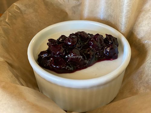 Tembleque, a Puerto Rican style coconut custard made w/ organic coconut milk & cane sugar topped w/ organic blueberry compote.  Vegan & GF at Maize & Barley in Edmonds