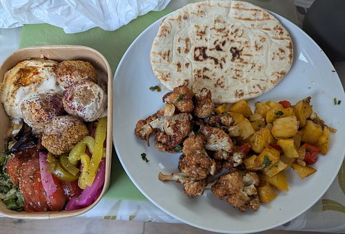 Salad Box and sides of spicy potatoes and cauliflower at Mr Falafel in West London