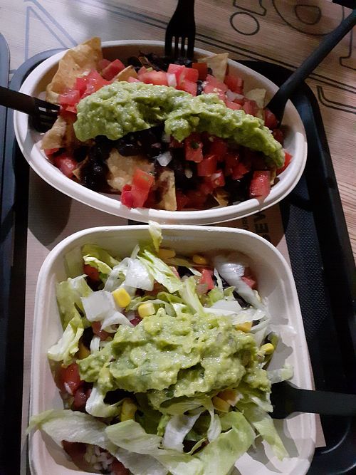 Salad and nachos with guacamole and vegetables at Burritos - Ramon LLull in Valencia