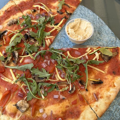 Veggie Deluxe Pizza (no cheese) with Hummuss  at The Crooked Cue in Mississauga
