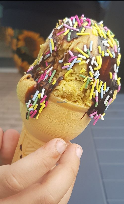 Salted caramel ice cream, with chocolate sauce and rainbow sprinkles at Cadwaladers - Mermaid Quay in Cardiff