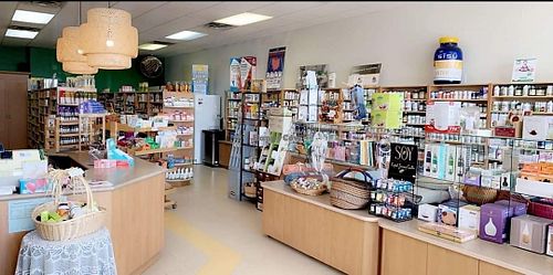 A view from the door as you come in. Several fridges and freezers in the back. at Aux Milles Herbes in Caraquet