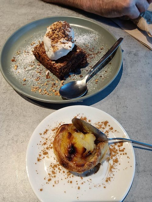 Caramel peanut butter brownie with ice cream & pastel de nata. at Kind Kitchen in Porto