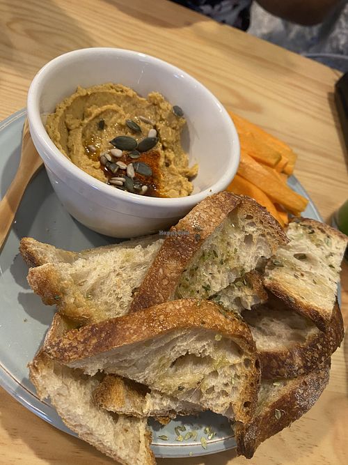 Hummus, sourdough and carrot sticks x at Kind Kitchen in Porto