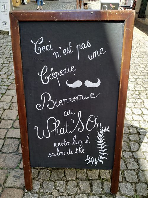 sign outside at What's On in Quimper