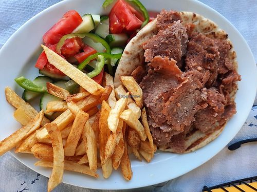 Vegan Gyros on Pita with fries and Greek salad at Mezza Volta in Corfu