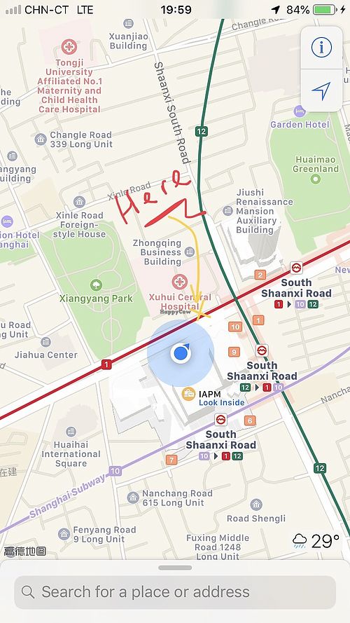 On the yellow cross. In this row of shops.  at Soybean in Shanghai