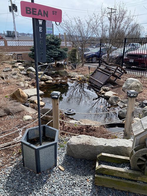 Their pond with a Bean Street sign at The Pink Bean in Somerset