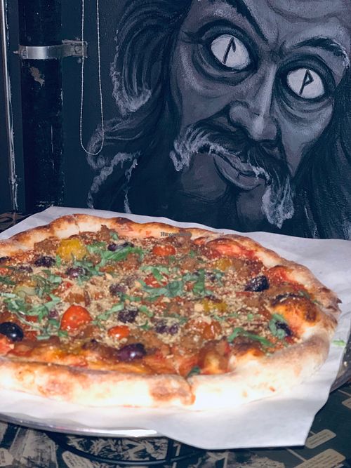 Frailty Pizza with Wall Art at The 4th Horseman in Long Beach