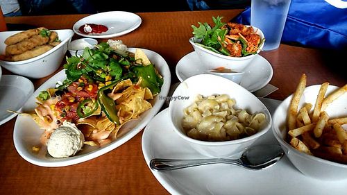 Chicken wings, nachos, fries, mac and cheese, and a side salad at Native Foods in West Los Angeles