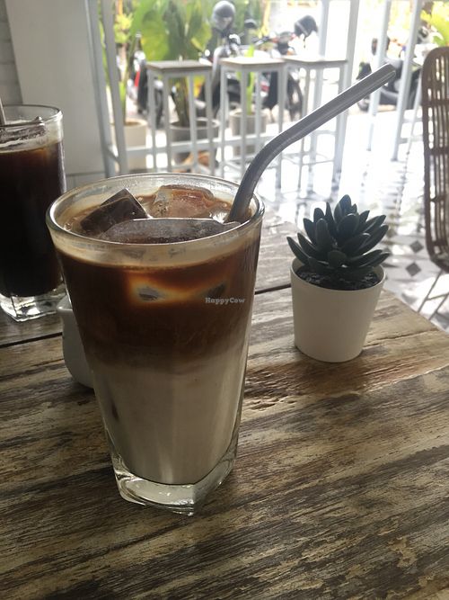 Iced latte with soy milk (sooo yummy) and served with simple syrup for optional sweetness at The Sloth in Canggu