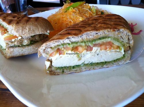 Chicken pesto sandwich with kelp salad, side view. at Golden Mean in Santa Monica
