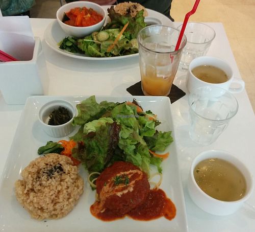 Their popular veggie burger plate & the daily lunch special in the background.  at Hanada Rosso in Tokyo
