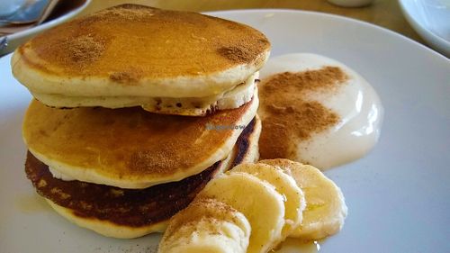 Vegan pancakes with banana & maple syrup at Secret Garden Cafe in Clitheroe