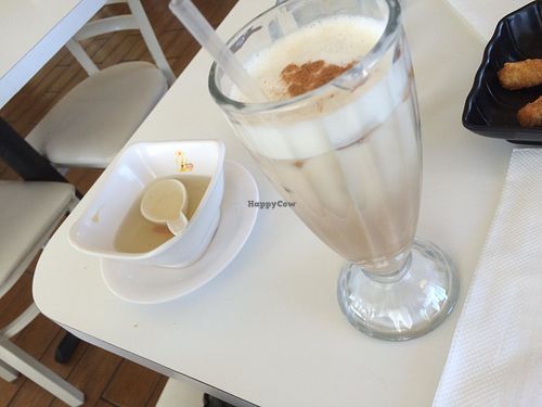 House soup broth they bring you before the meal and an iced chai latte. at Loving Hut - Glendale in Glendale