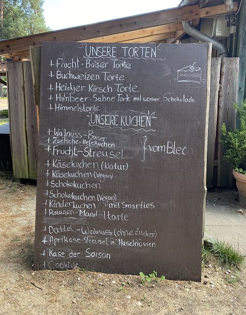 Vegan cheesecake and chocolate cake in the extensive cake menu  at Der Schafstall in Handeloh