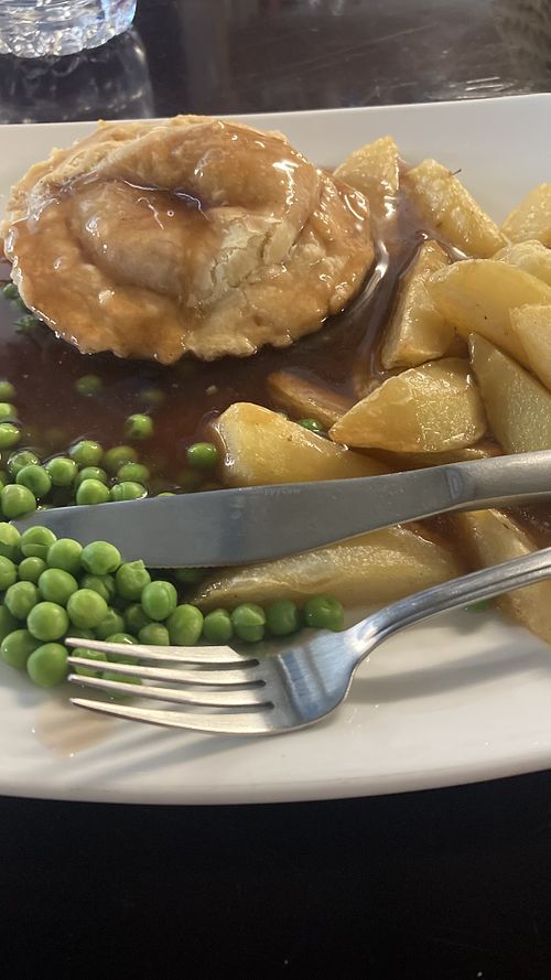 Chicken and mushroom pie with peas, chips and gravy  at Filthy Vegan in Ho Chi Minh City