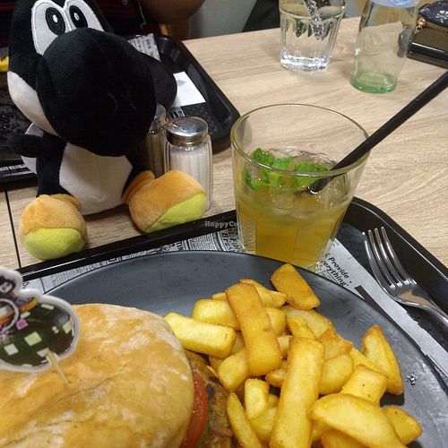 Yoshi is looking at my vegan burger ! at DVision eSports Diner in Cologne