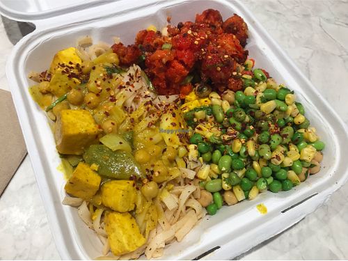 Vegan tofu curry, buffalo cauliflower, and sides  at Fat Rabbit in Ottawa