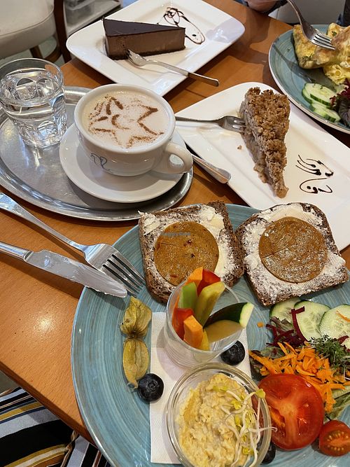 Heart of Joy brunch platter with chai latte, chocolate cake and apple crumb cake!  at The Heart of Joy in Salzburg