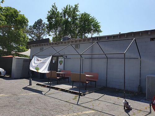 Entrance and outside sitting area at H.O.M.E. Vegan Restaurant (TheHouseOfMentalEatery) in Little Rock