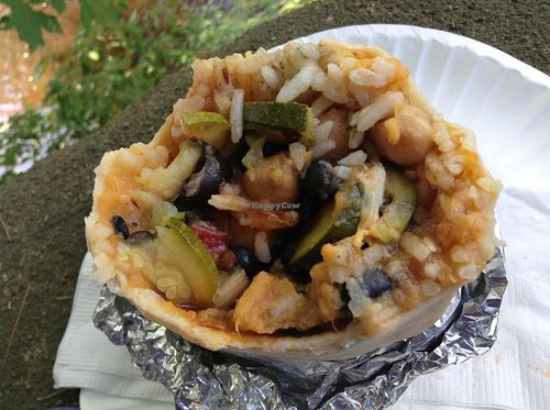 House vegetarian burrito with chickpeas, black beans, sweet potato, roasted zucchini, pico de gallo, sweet & spicy mango vinaigrette at De Olla Burritos in Peterborough