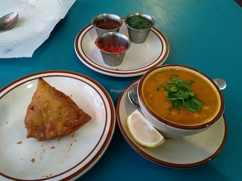 Vegetable Samosa, Mulligatawny soup, chutneys. at Aavtar Indian Cuisine in Daytona Beach