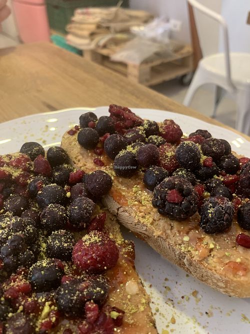 Peanut butter toast with frozen fruit  at Hija Mia in Medellin