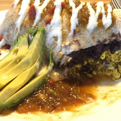 BREAKFAST BURRITO (Refried black beans and your choice of home fries, sweet potatoes, or rice, wrapped in a tortilla and smothered with gravy or green chili) at Watercourse Foods in Denver