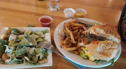 Sink your teeth into this luscious Classic Burger and Fries -- side Caesar salad, and lunch is complete! at Watercourse Foods in Denver