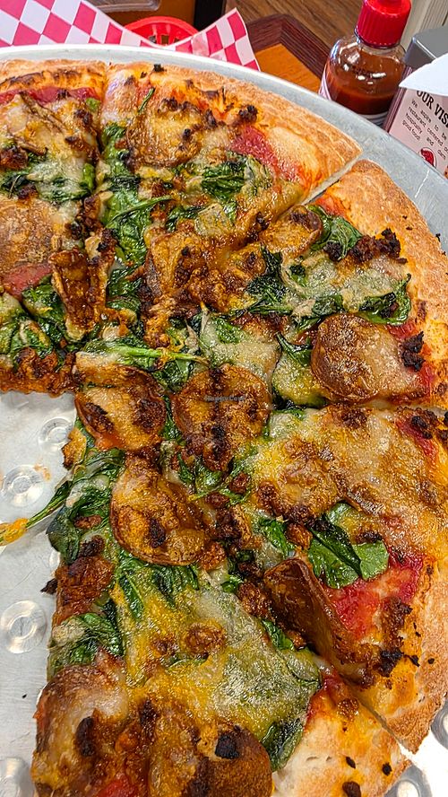 Vegan pepperoni, v sausage, v cheese, spinach at Jim's Razorback Pizza in Fort Smith