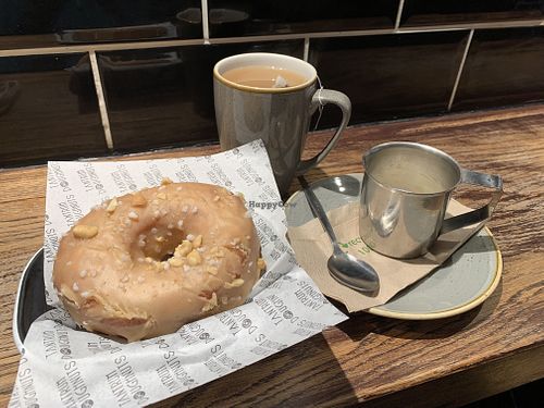 Vegan peanut butter ring doughnut and Earl Grey tea with oat milk  at Tantrum Doughnuts in Glasgow