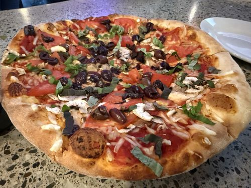 Tomato, basil, mushrooms, kalamata olives and vegan cheesee  at Piecasso in Stowe