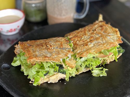 Hash brown sandwich stuffed w broccoli, amazing but want to try them all (5 or 6 fillings to choose from!)  at Revolucion Bananera in Jardin