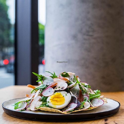 shaved crimini mushrooms, picked red onions, soft boiled egg and red wine vinaigrette on a crisp pappadom at Little Gem on Grove in San Francisco