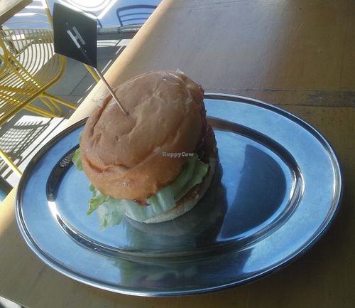 This vegan burger is called the "Sondra". Kale, zucchini & quinoa patty, hummus,  pickled onion, beetroot, tomato, lettuce. $12.90 at Huxtaburger in Footscray