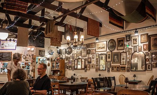 interior with Noel depicted standing at Bloodroot in Bridgeport