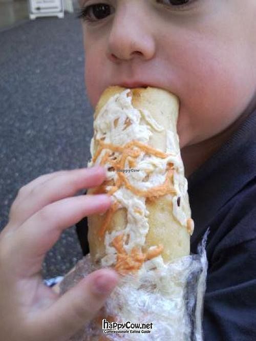 Cheezy breadstick so good, my son wouldn't stop eating it to take the picture. at Karmavore in New Westminster